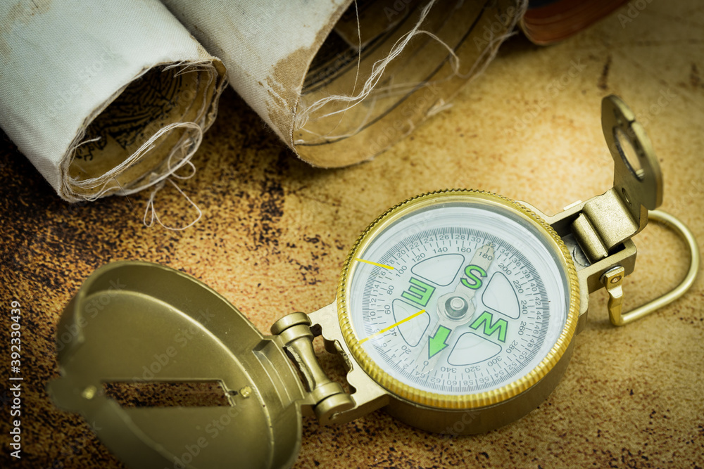Poster old maps with a compass. the concept of expeditions and travel, discovering the world