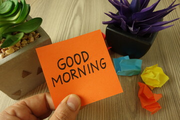 Text good morning handwritten on sticky note