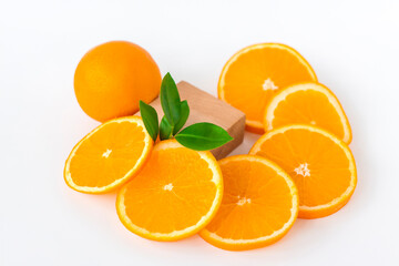 Cut orange on a white background. Natural orange fruit with cut slices. Vitamin C.