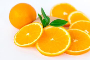 Cut orange on a white background. Natural orange fruit with cut slices. Vitamin C.