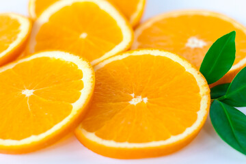 Cut orange on a white background. Natural orange fruit with cut slices. Vitamin C.