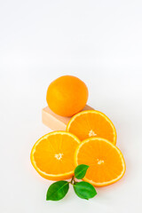 Cut orange on a white background. Natural orange fruit with cut slices. Vitamin C.
