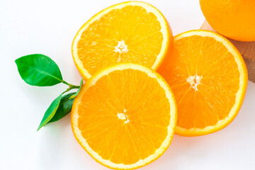 Cut orange on a white background. Natural orange fruit with cut slices. Vitamin C.