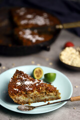 Fragrant delicious piece of oat cake on a plate. Oatmeal cake with seeds and fruits.