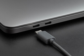 Close-up photo of laptop with type-c cable