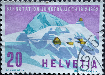 Switzerland - Circa 1962 : a postage stamp printed in the swiss showing the mountain range of the...