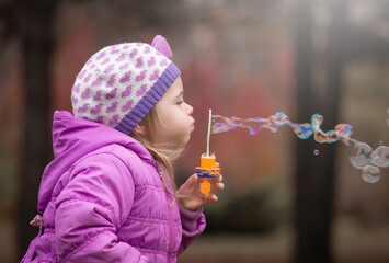  Girl, garden, lilac coat, soap bubble blower