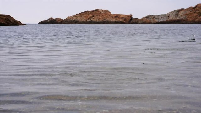 stones bouncing in the sea water