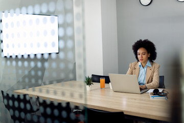 African American businesswoman working on a computer in the office.