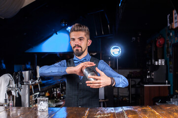 Barman creates a cocktail in the pothouse