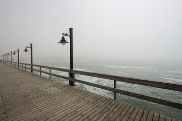 Wooden pier on a foggy day