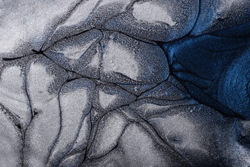 Silver and blue metallic futuristic background. Make up concept.Beautiful abstract stains of liquid nail laquers.Fluid art,pour painting technique.Horizontal banner,can be used as backdrop for chat.