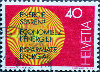 yellow sun with the text save energy.  in three languages  D, FR, IT