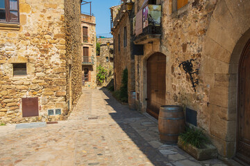 Obraz premium Cozy narrow little streets in a Catalan fishing village on the Costa Brava, Mediterranean Sea
