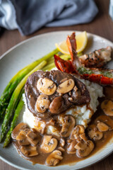 surf and turf, lobster tail and tenderlon steak with mushroom gravy sauce