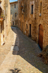Fototapeta premium Cozy narrow little streets in a Catalan fishing village on the Costa Brava, Mediterranean Sea