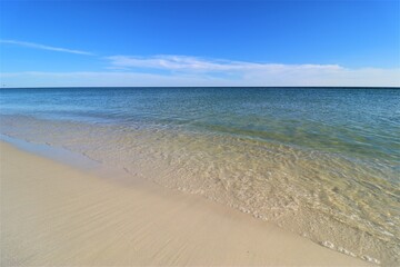 Fototapeta na wymiar Sand, ocean, sky, tranquility and relaxation, photo taken on the beach of Santa Rose Island, Gulf of Mexico