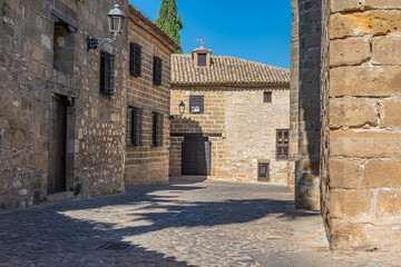 Fototapeta na wymiar Old stoned alley in Baeza city, declared along with ubeda as world heritage by unesco