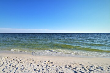 Sand, ocean, sky, tranquility and relaxation, photo taken on the beach of Santa Rose Island, Gulf of Mexico