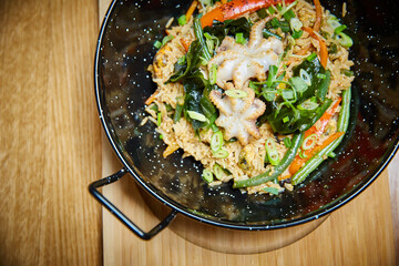 octopus  with rice in a pan