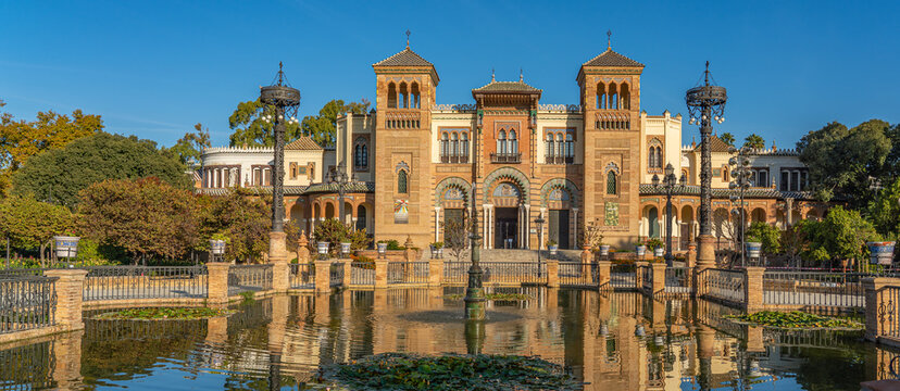 The Plaza de America and the Museum of Popular Arts in Seville, Spain. It is located in the Parque de Maria Luisa. panorama