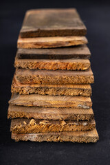 Raw boards piled up. Wood on the table in the workshop.