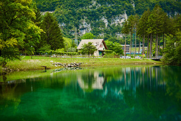 landscape with a pond and a house