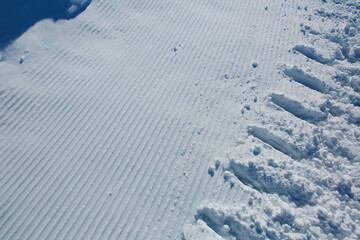 pattern of groomed snow in ski area