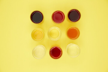 colored drinks on a yellow background