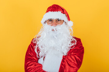 Fototapeta na wymiar Portrait of Santa Claus on yellow background. Christmas concept