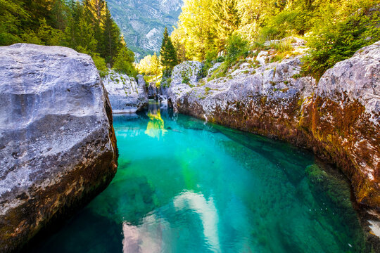 Wonderful turquoise Soca river in the Lepena valley, rocky part popular bathing place in summer
