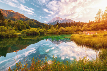 Beautiful Zelenci lake in the Julia Alps in Triglav National Park near Kranjska Gora at sunset
