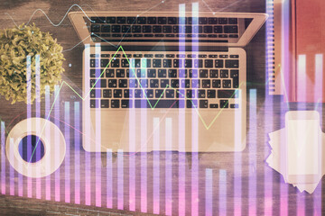 Stock market chart and top view computer on the table background. Multi exposure. Concept of financial analysis.
