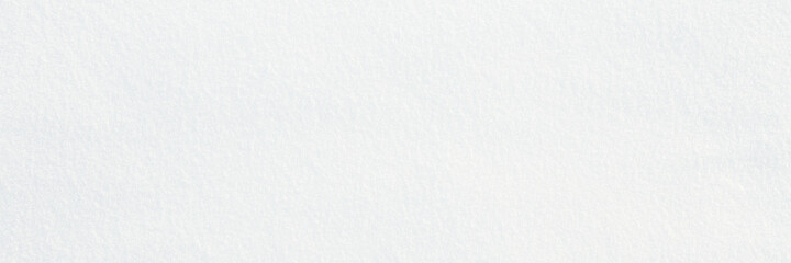 Obraz premium Natural snow texture. Smooth surface of clean fresh snow. Snowy ground. Winter background with snow patterns. Perfect for Christmas and New Year design. Closeup top view.