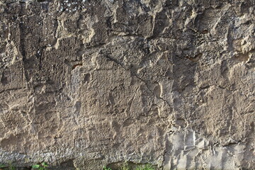 Gelb grau verputzte Betonmauer