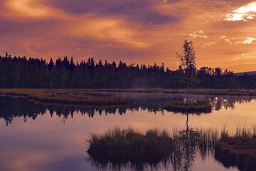 Fototapeta na wymiar Mountain Lake Laka in Sumava national park in Czech republic. Sunset sky.