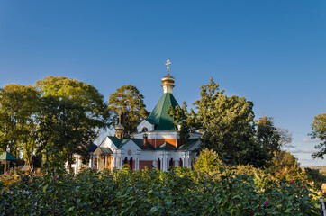 Fototapeta na wymiar Orthodox Christian church surrounded by trees