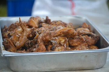chicken wings with souce in a pan