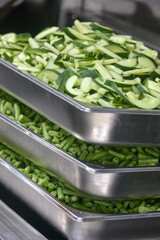 cucumber chunks in a stainless steel container
