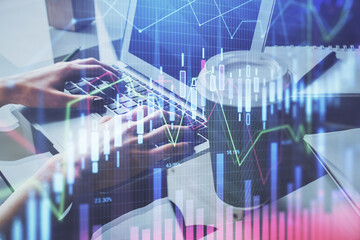 Double exposure of woman hands typing on computer and forex chart hologram drawing. Stock market invest concept.