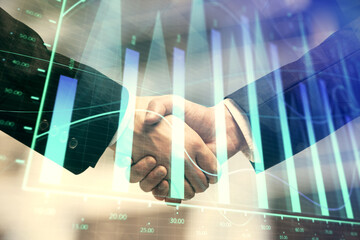 Double exposure of forex graph hologram and handshake of two men. Stock market concept.