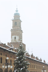 Fototapeta na wymiar Piazza Ducale and Sforza Castle in Vigevano during a snowfall in 2012