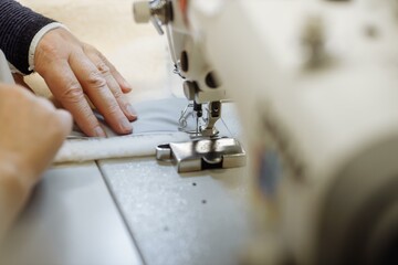 sewing machine scribbling fabric. tailoring at the factory