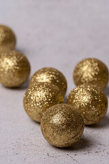 Close-up of gold-coloured Christmas balls on a white background