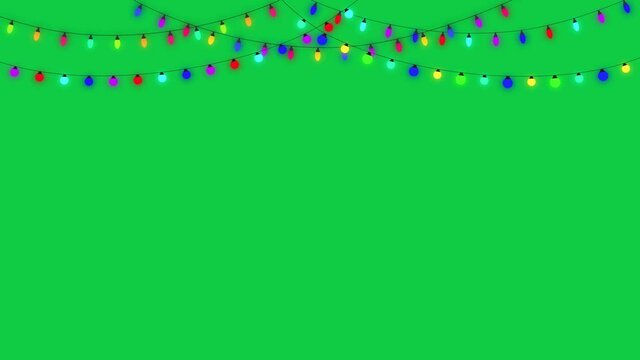 Christmas string lights on a green screen background animation footage, colorful lamps,light show for new year design.