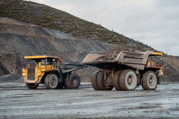 Movement of dump trucks at the gold mining site.