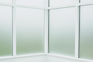 Large glass windows in a bright studio