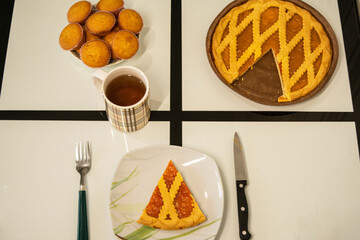 festive sweet table with pumpkin pie and cupcakes top view