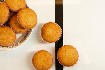 holiday cupcakes on a plate and on the table