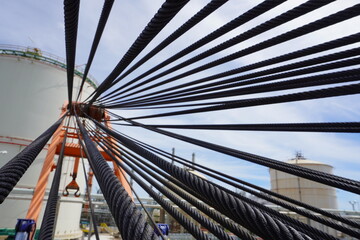 Fototapeta na wymiar Wire rope sling or cable sling on crane reel drum or winch roll of crane the lifting machine in heavy industrial.
